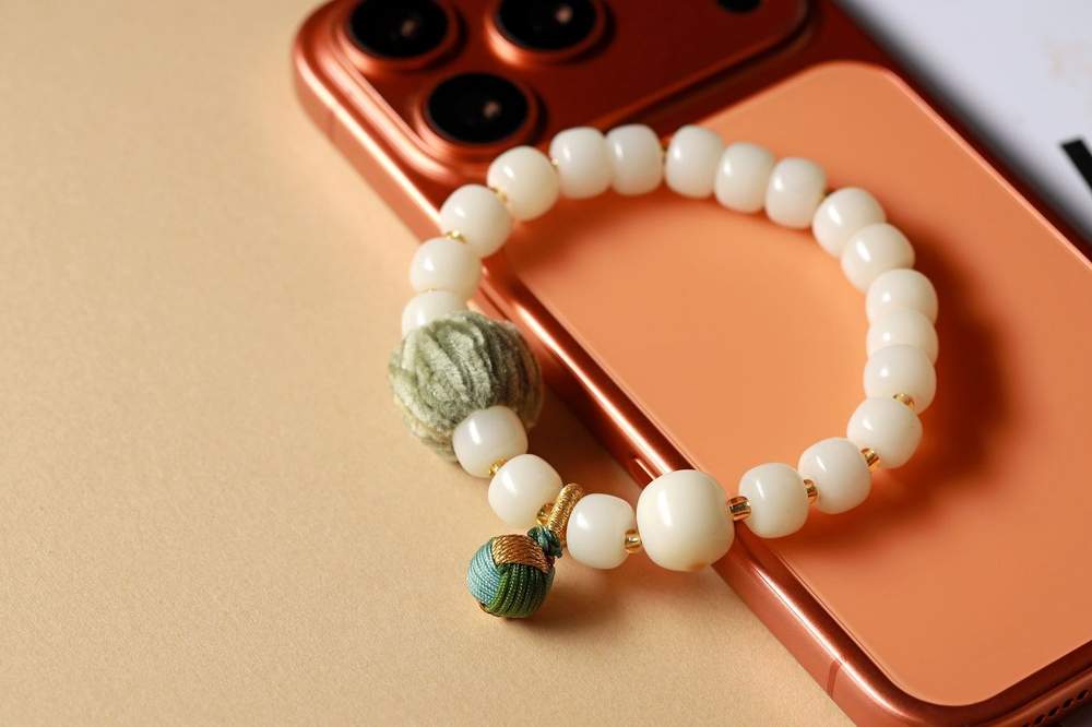 White Beaded Bracelet with Green Woven Accent — product image 1