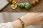 Fortune Wheel green sandalwood gourd bracelet detail