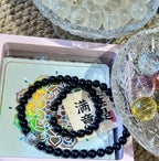 Black Beaded Bracelet with Silver Charms — product image 1