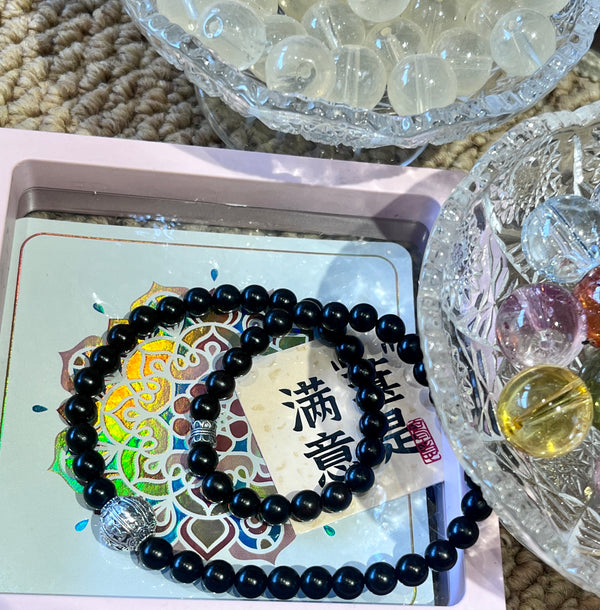 Black Beaded Bracelet with Silver Charms