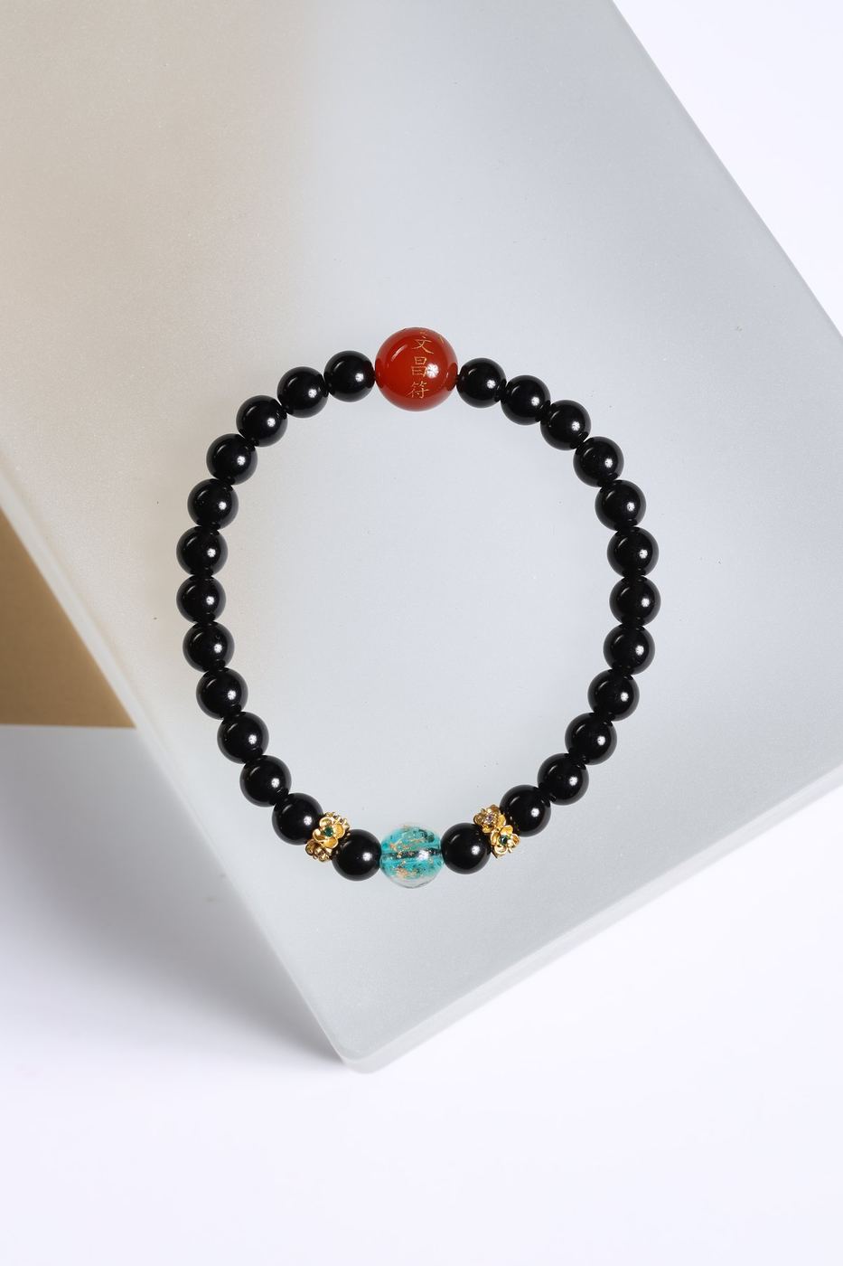 Black Beaded Bracelet with Red & Blue Accents — product image 1