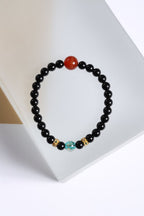 Black Beaded Bracelet with Red & Blue Accents — product image 1