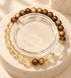 Balanced Heart wood bead bracelet and clear bangle - editorial view