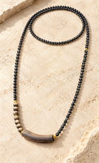 Black beaded wood pendant necklace - complete flat lay