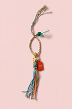 Colorful Woven Tassel Charm with Red Tag — product image 1