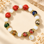 Multicolor Beaded Bracelet with Carved Red Accents - product image 1