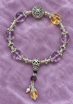 Purple Crystal Beaded Bracelet with Silver Charms - product image 1