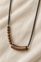Black Beaded Wood Pendant Necklace - studio image