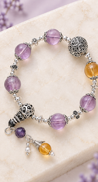 Purple crystal bracelet with silver charms - editorial view