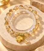 Resilient Spirit golden rutile bracelet and clear bangle - editorial view