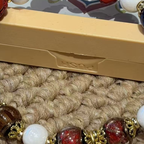 Multicolor Beaded Bracelet with Carved Red Accents — product detail