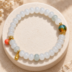 Tianshan jade beaded bracelet on stone display
